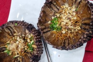 grilled sea urchin with scallion oil